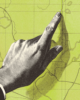 Hand tracing along a road on a map