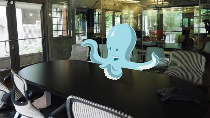 Tako at the conference room table